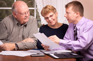 Photo of Senior Couple talking to Insurance Agent