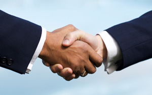 Photo of two businessmen shaking hands